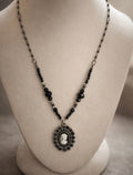 Vintage cameo and black glass